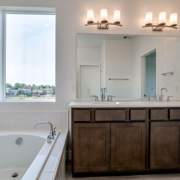 Representative furnished interior of a home built from the The Ethridge by David Weekley Homes in Revel Crossing at Wolf Ranch - The Panorama Collection, Colorado Springs (Image 3).