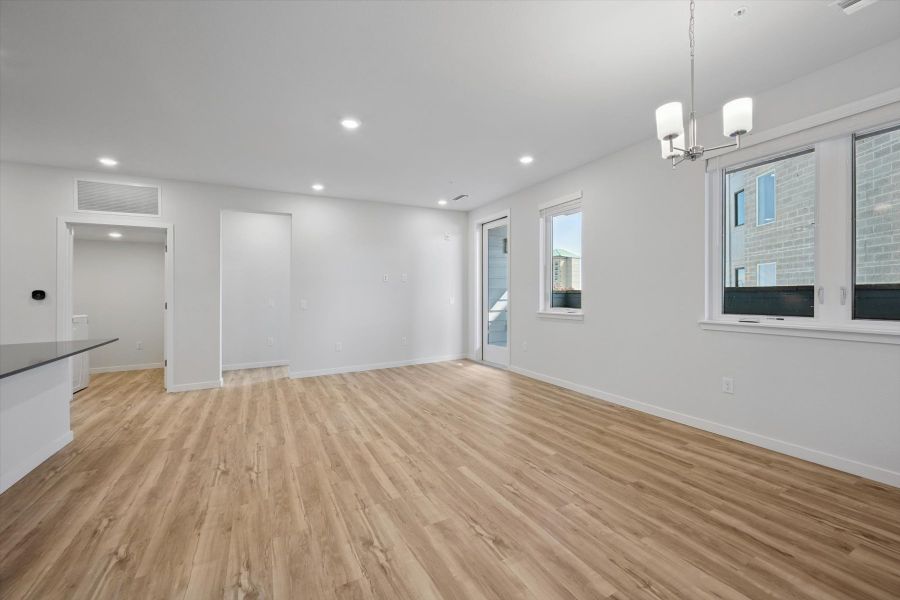 A room with a wood floor and white walls. A room with a wood floor and white walls.