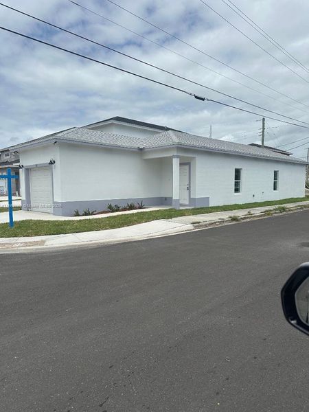 Front exterior of a new home in , Boynton Beach, FL, highlighting curb appeal (Image 21).