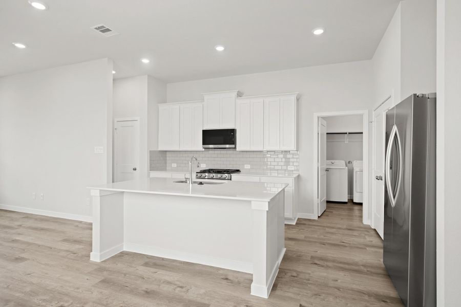 Furnished interior view inside a new home in Creekland Village at Bridgeland, Cypress (Image 14).