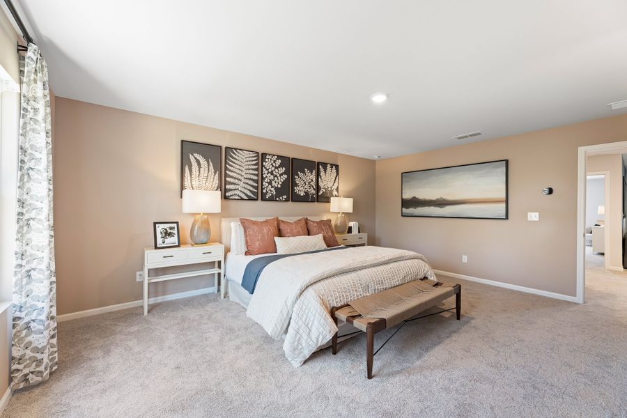 A bedroom with a bed and lamps. A bedroom with a bed and lamps.