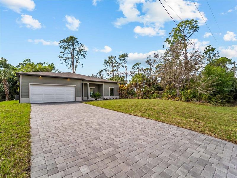 Front exterior of a new home in , North Port, FL, highlighting curb appeal (Image 26).