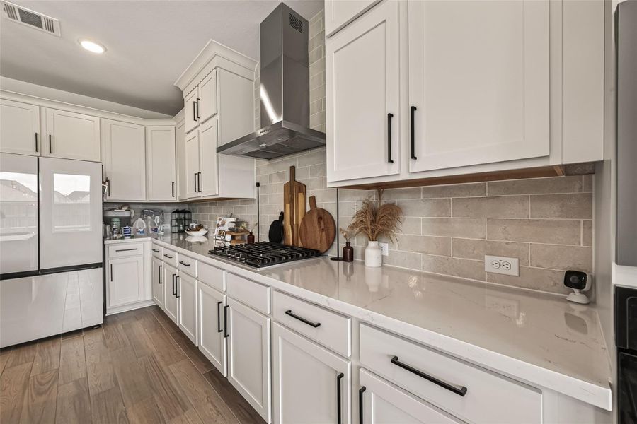 Prepare meals with ease on the gas cooktop surrounded by generous counter space. Prepare meals with ease on the gas cooktop surrounded by generous counter space.