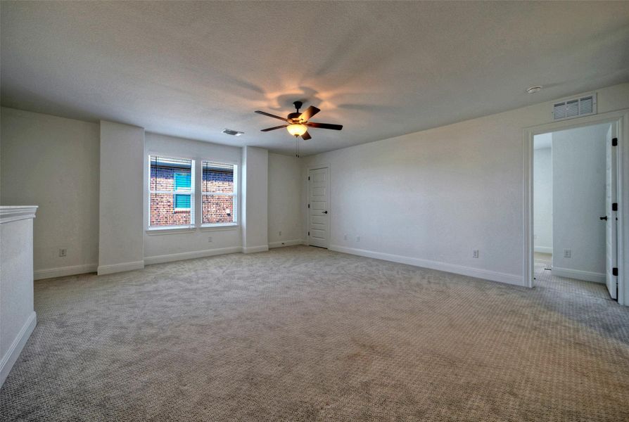 Plush carpeting and wide windows frame this versatile living space. Plush carpeting and wide windows frame this versatile living space.