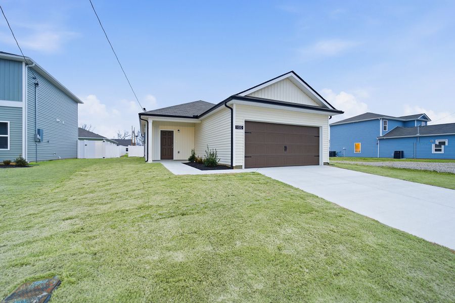 Front exterior of a new home in Stonehenge, Manchester, TN, highlighting curb appeal (Image 2). Front exterior of a new home in Stonehenge, Manchester, TN, highlighting curb appeal (Image 2).