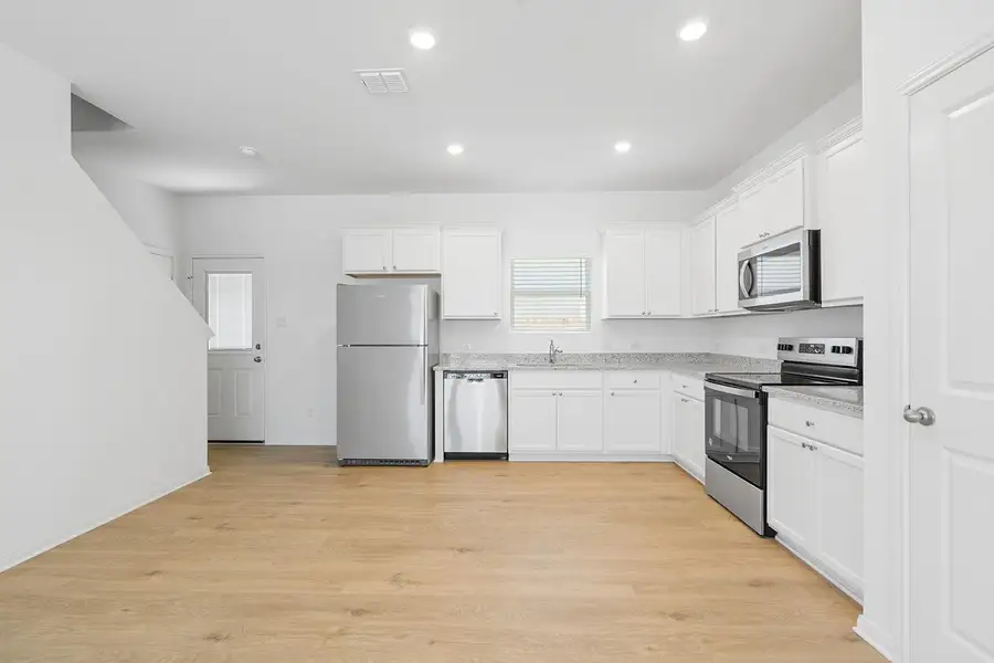 Furnished interior view inside a new home in Cypress Trails at Bauer Landing, Hockley (Image 4).