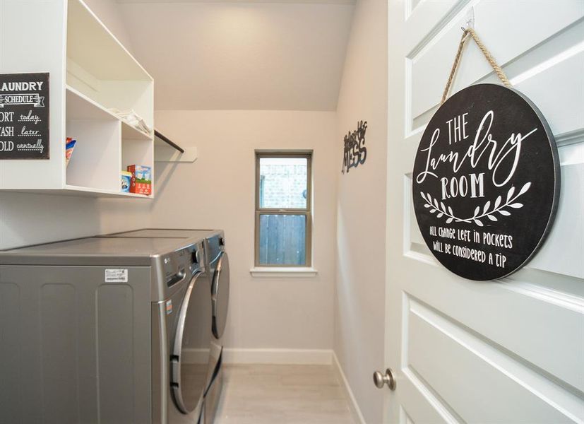 Modern Laundry Space: Featuring efficient appliances, ample shelving, and a bright, welcoming design.