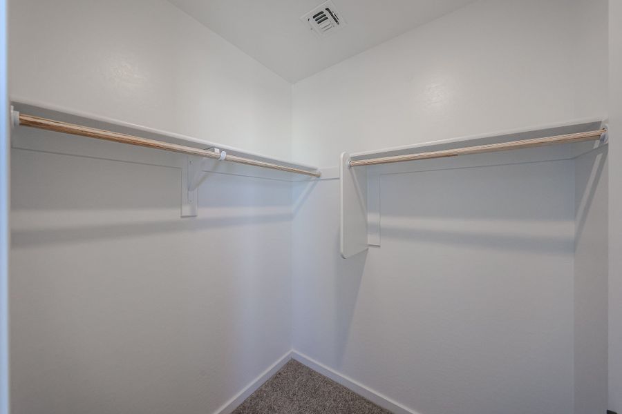 A white wall with a metal bar. A white wall with a metal bar.