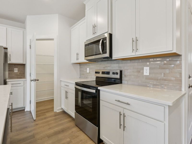 Furnished interior view inside a new home in Cedarcrest Townhomes, Fairview (Image 4).