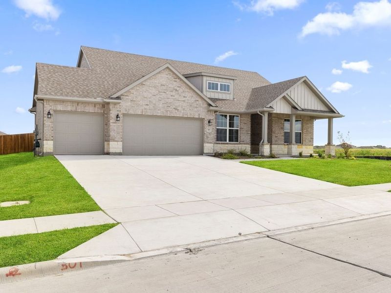 Front exterior of a new home in Waverly Estates, Nevada, TX, highlighting curb appeal (Image 2). Front exterior of a new home in Waverly Estates, Nevada, TX, highlighting curb appeal (Image 2).