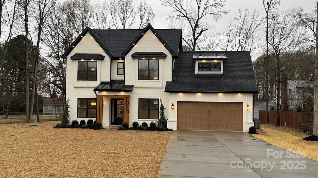 Front exterior of a new home in , Indian Trail, NC, highlighting curb appeal (Image 1). Front exterior of a new home in , Indian Trail, NC, highlighting curb appeal (Image 1).