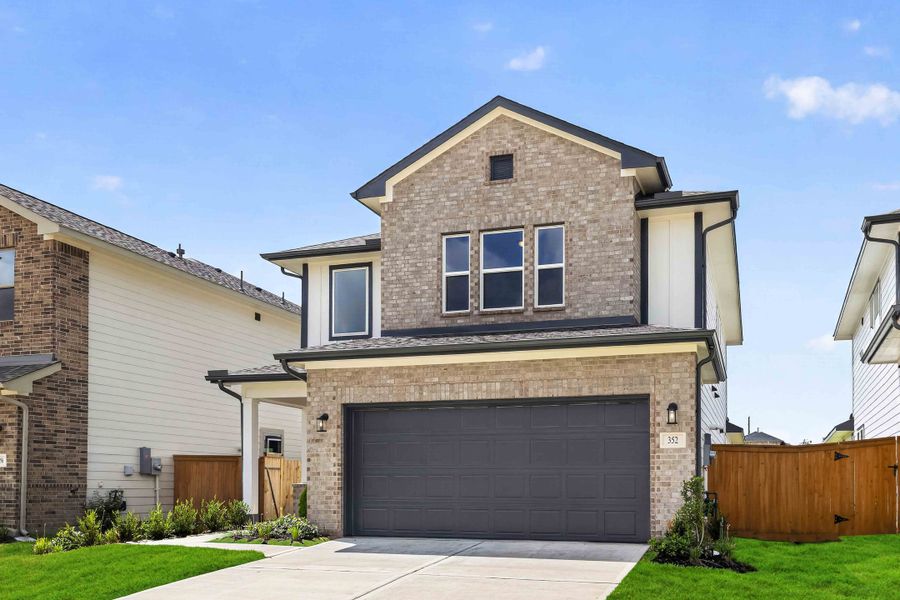 Front exterior of a new home in La Segarra 40', Brookshire, TX, highlighting curb appeal (Image 2). Front exterior of a new home in La Segarra 40', Brookshire, TX, highlighting curb appeal (Image 2).