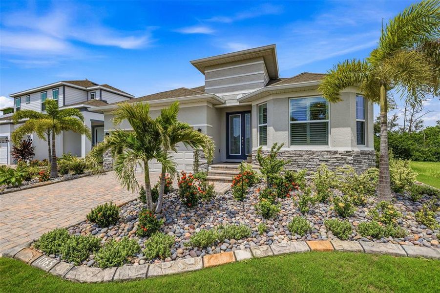 Front exterior of a new home in , Apollo Beach, FL, highlighting curb appeal (Image 1). Front exterior of a new home in , Apollo Beach, FL, highlighting curb appeal (Image 1).