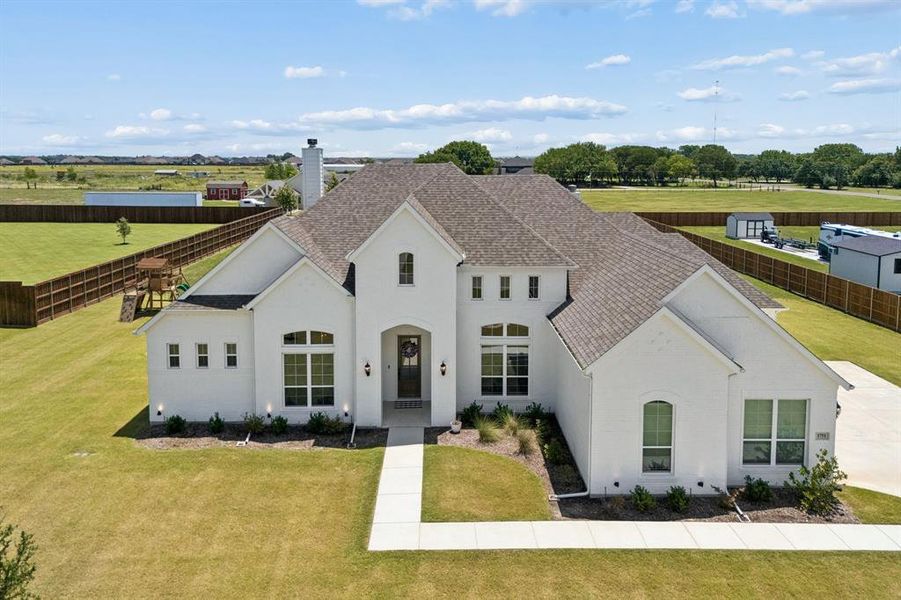 Front exterior of a new home in Springside Estates, Waxahachie, TX, highlighting curb appeal (Image 23). Front exterior of a new home in Springside Estates, Waxahachie, TX, highlighting curb appeal (Image 23).
