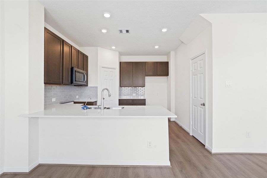This spacious kitchen has it all—ample storage, generous counter space, and a layout that truly makes it the heart of the home. This spacious kitchen has it all—ample storage, generous counter space, and a layout that truly makes it the heart of the home.