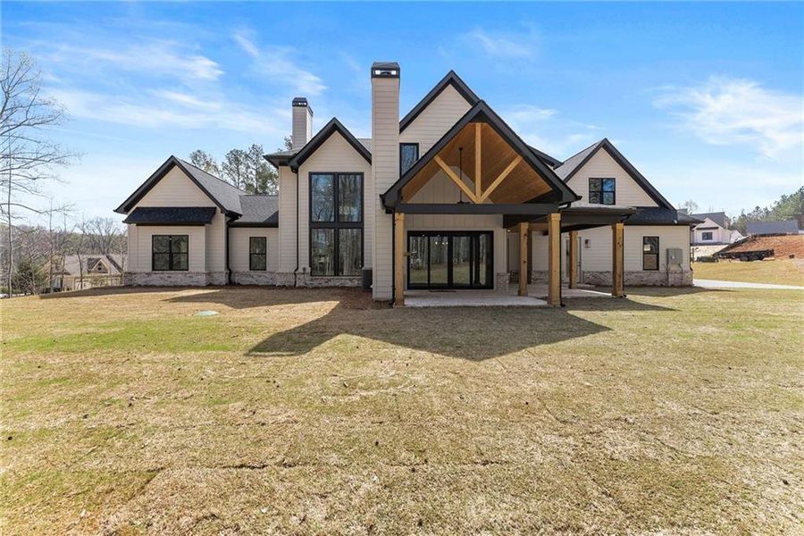 Front exterior of a new home in , Hoschton, GA, highlighting curb appeal (Image 32).