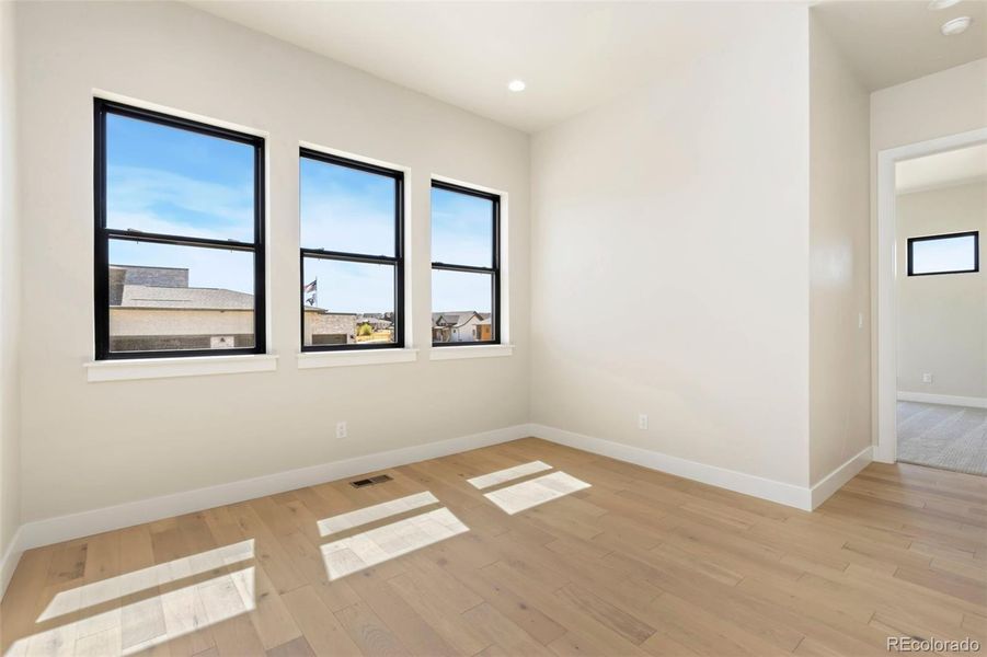 Spacious, unfurnished interior of a new home in Acadia at RainDance, Windsor (Image 11).