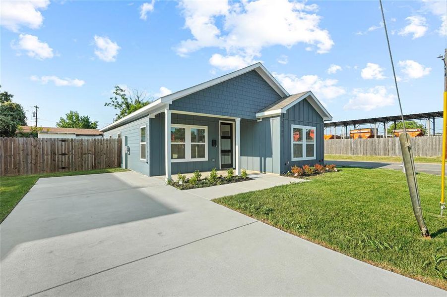Front exterior of a new home in , Dallas, TX, highlighting curb appeal (Image 14).