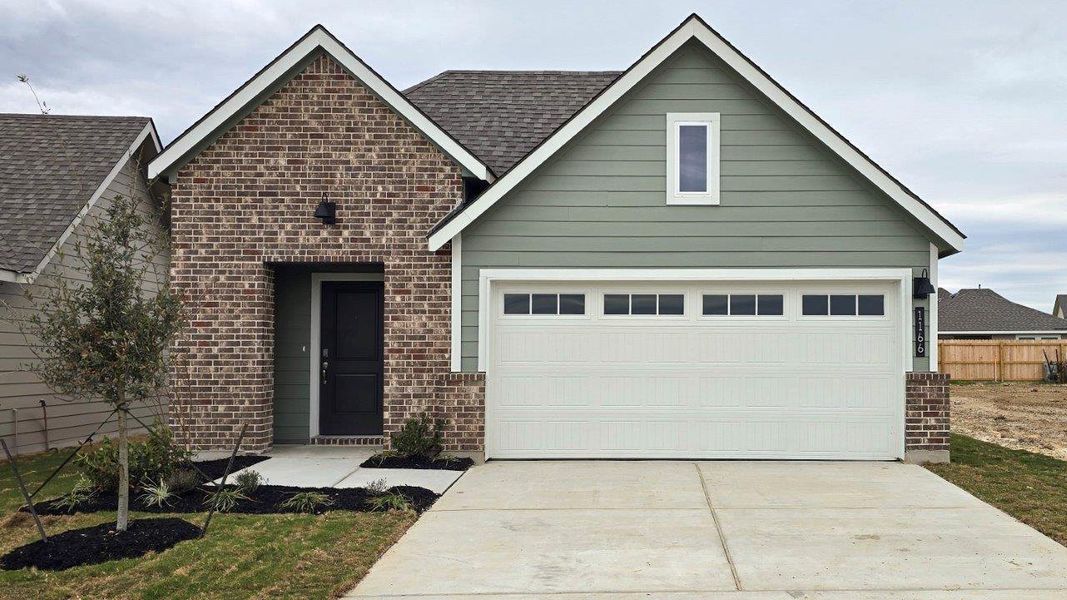 Front exterior of a new home in Midtown Reserve, College Station, TX, highlighting curb appeal (Image 1). Front exterior of a new home in Midtown Reserve, College Station, TX, highlighting curb appeal (Image 1).