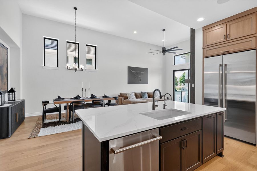 An open concept design seamlessly blends the kitchen, dining, and living areas. An open concept design seamlessly blends the kitchen, dining, and living areas.