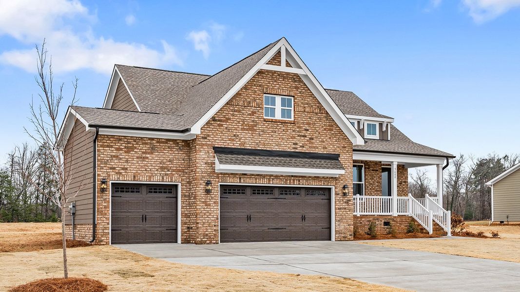 Front exterior of a new home in Lilah Grove, Summerfield, NC, highlighting curb appeal (Image 26).