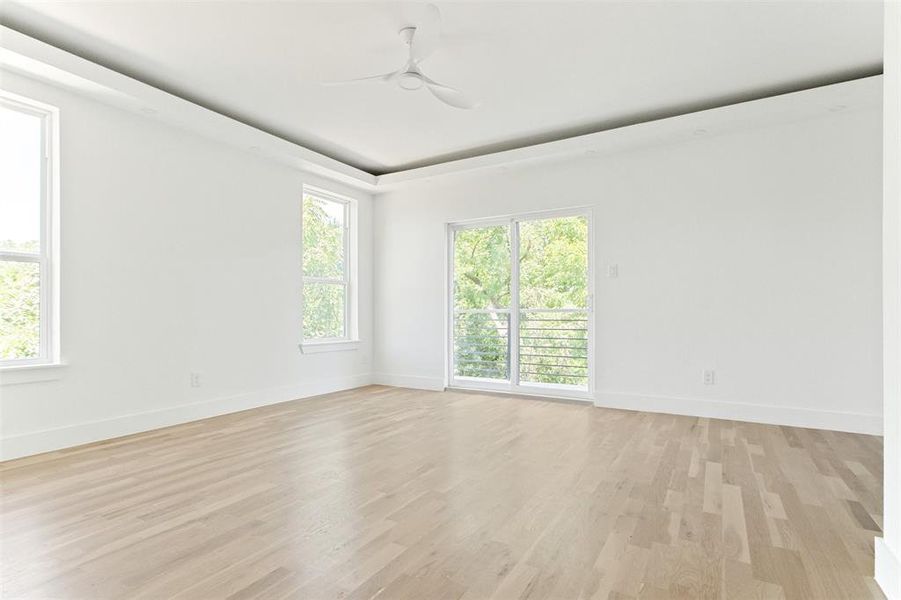 Spare room with ceiling fan and light hardwood / wood-style flooring