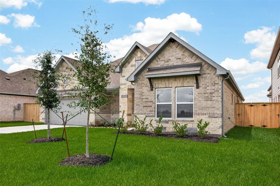 Front exterior of a new home in Foxtail Palms, Manvel, TX, highlighting curb appeal (Image 26). Front exterior of a new home in Foxtail Palms, Manvel, TX, highlighting curb appeal (Image 26).