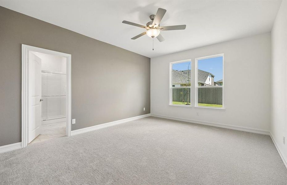 Primary suite with large windows Primary suite with large windows
