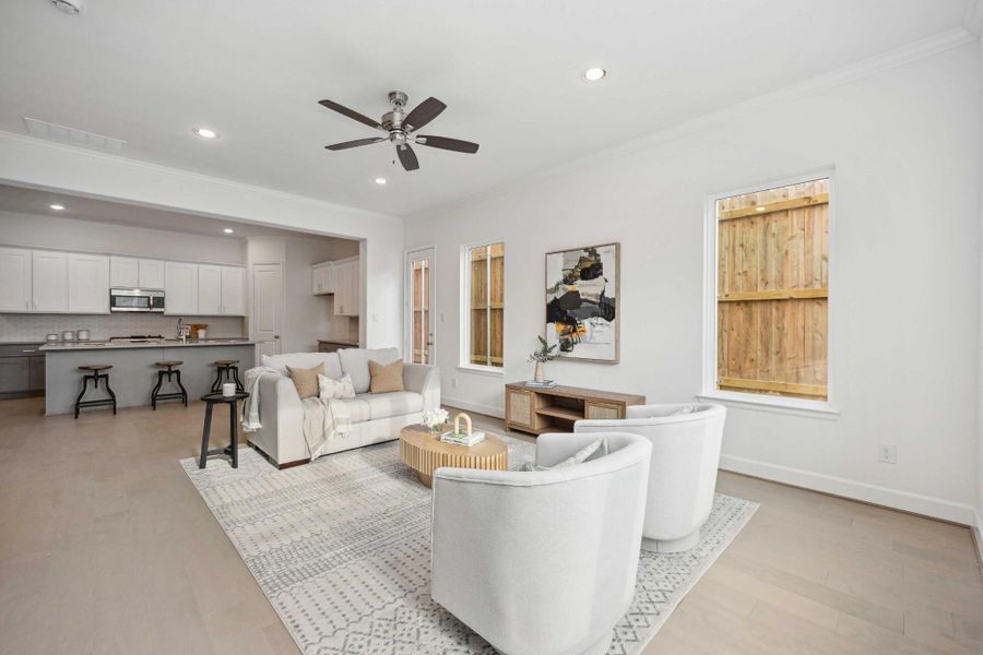 Open-concept goals. The transition from living to kitchen is effortless, with warm wood floors and clean lines that make everything feel connected and calm. Open-concept goals. The transition from living to kitchen is effortless, with warm wood floors and clean lines that make everything feel connected and calm.