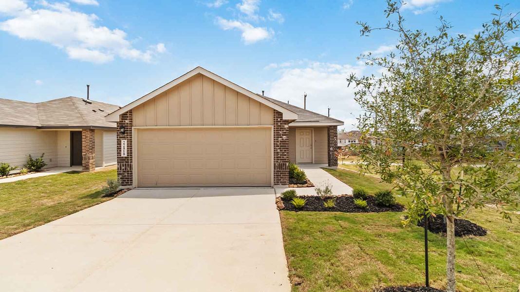 Representative exterior photo of a completed home built from the Atlanta by D.R. Horton in Watermark, Alvin, TX (Image 1).