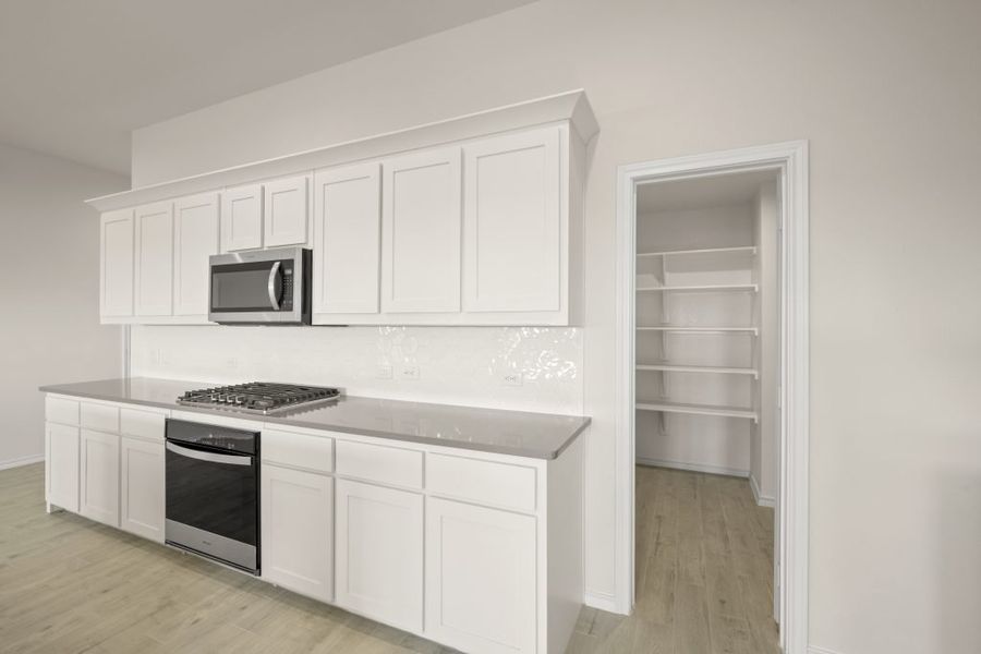 Front exterior of a new home in Myrtle Creek, Waxahachie, TX, highlighting curb appeal (Image 9). Front exterior of a new home in Myrtle Creek, Waxahachie, TX, highlighting curb appeal (Image 9).