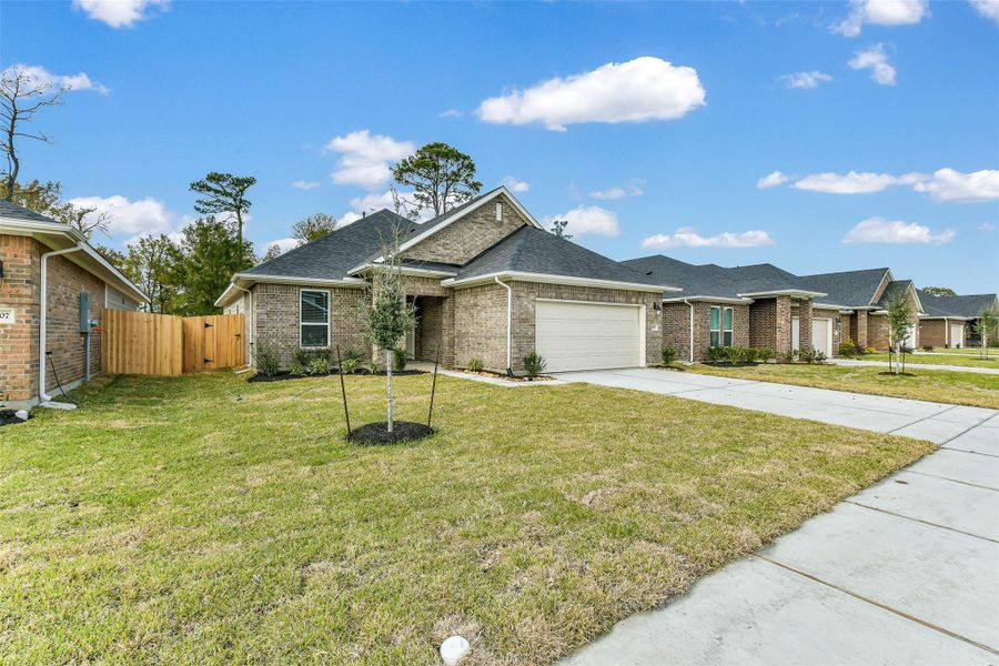 Front exterior of a new home in King Oaks Village, Baytown, TX, highlighting curb appeal (Image 19). Front exterior of a new home in King Oaks Village, Baytown, TX, highlighting curb appeal (Image 19).