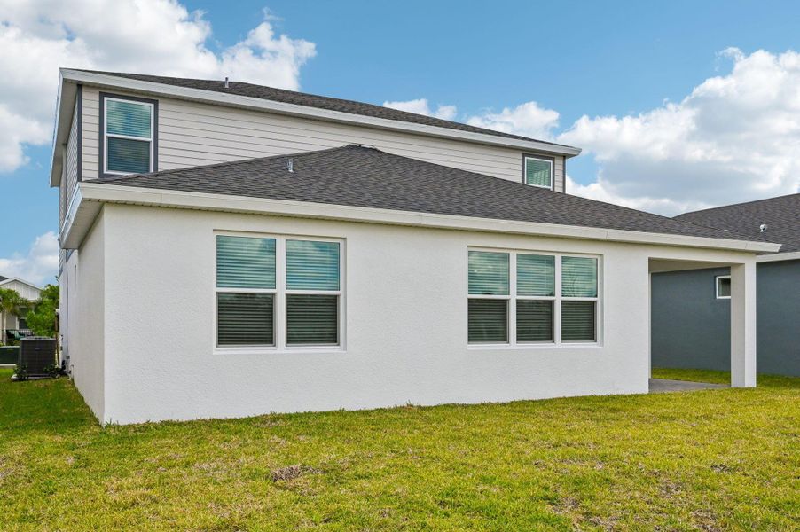 Exterior details and patio area of a home in Brystol at Wylder - Reserve Series, Port St. Lucie (Image 3).