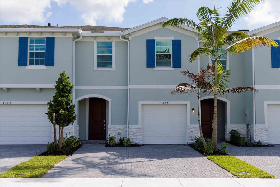 Coastal style architecture with a 2-car driveway