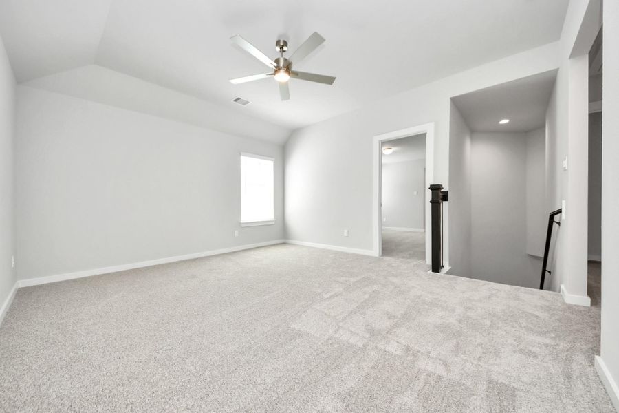 Ascend to relaxation in this fantastic game room! Ideal for both casual gatherings and adult gaming, it boasts plush carpet, lofty ceilings, custom paint, and ample windows for abundant natural light. Sample photo of completed home with similar floor plan. Actual colors and selections may vary. Ascend to relaxation in this fantastic game room! Ideal for both casual gatherings and adult gaming, it boasts plush carpet, lofty ceilings, custom paint, and ample windows for abundant natural light. Sample photo of completed home with similar floor plan. Actual colors and selections may vary.