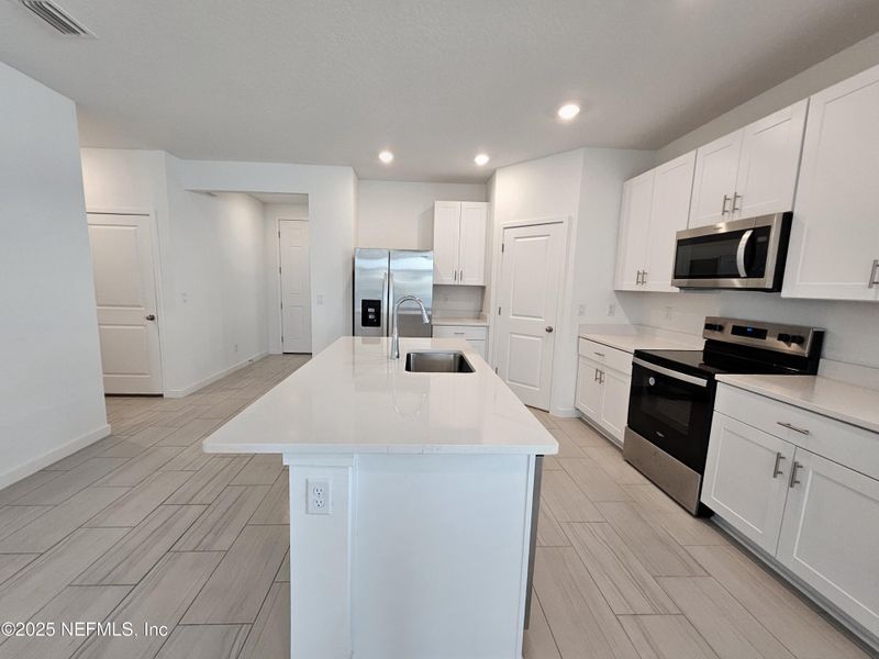 Furnished interior view inside a new home in Lakes at Bella Lago - Signature Series, Green Cove Springs (Image 8).