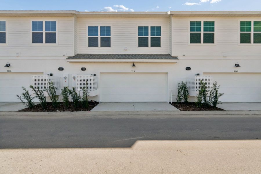 Exterior details and patio area of a home in Emerald Landing at Waterside at Lakewood Ranch – Towns, Sarasota (Image 3).