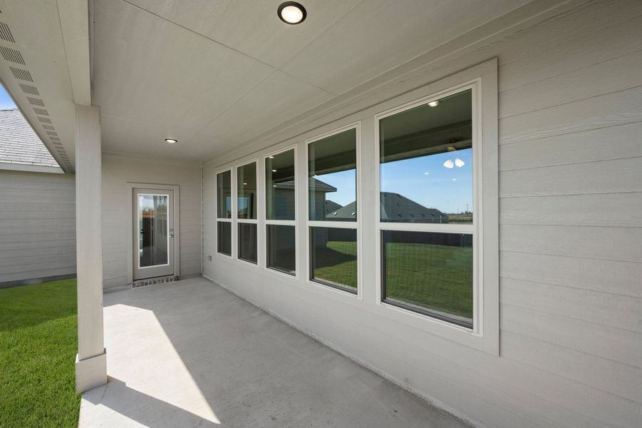 Front exterior of a new home in Still Water Lake Estates, Godley, TX, highlighting curb appeal (Image 29). Front exterior of a new home in Still Water Lake Estates, Godley, TX, highlighting curb appeal (Image 29).