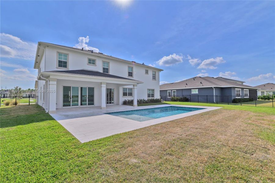 Exterior details and patio area of a home in Arden: The Waterford Collection, Loxahatchee (Image 33).
