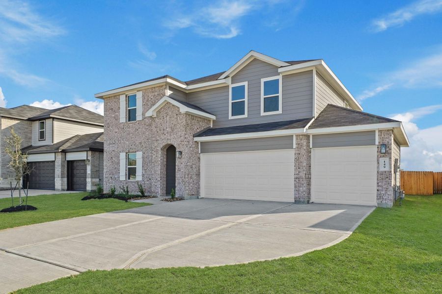 Front exterior of a new home in Medina, Dayton, TX, highlighting curb appeal (Image 2). Front exterior of a new home in Medina, Dayton, TX, highlighting curb appeal (Image 2).