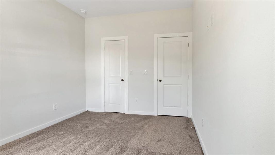 Unfurnished bedroom featuring carpet