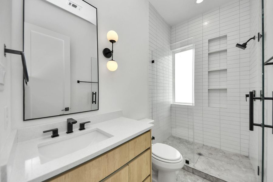 Full bathroom serving the third-floor secondary bedroom.