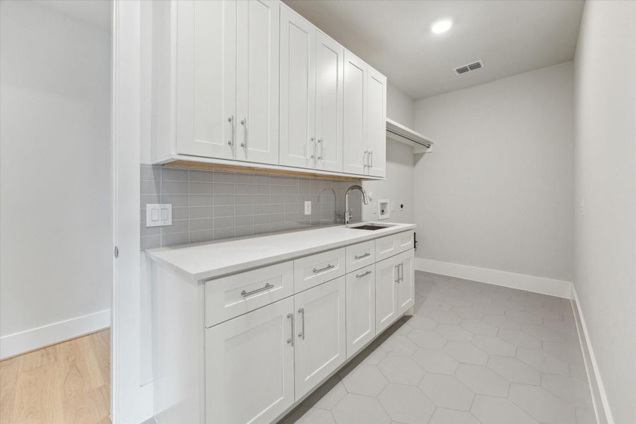 The laundry room can be accessed through the primary bathroom or the hallway! The laundry room can be accessed through the primary bathroom or the hallway!