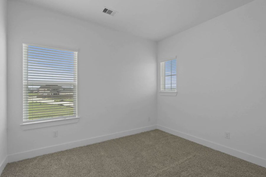 Representative unfurnished interior of a home built from the St Andrews by Chesmar Homes in Riceland Alley Loads, Mont Belvieu (Image 49).