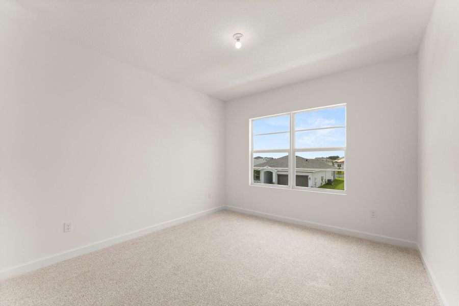 Spacious, unfurnished interior of a new home in Tradition - Cadence, Port St. Lucie (Image 12).