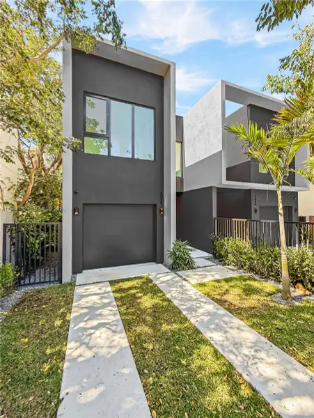 Front exterior of a new home in , Miami, FL, highlighting curb appeal (Image 1). Front exterior of a new home in , Miami, FL, highlighting curb appeal (Image 1).