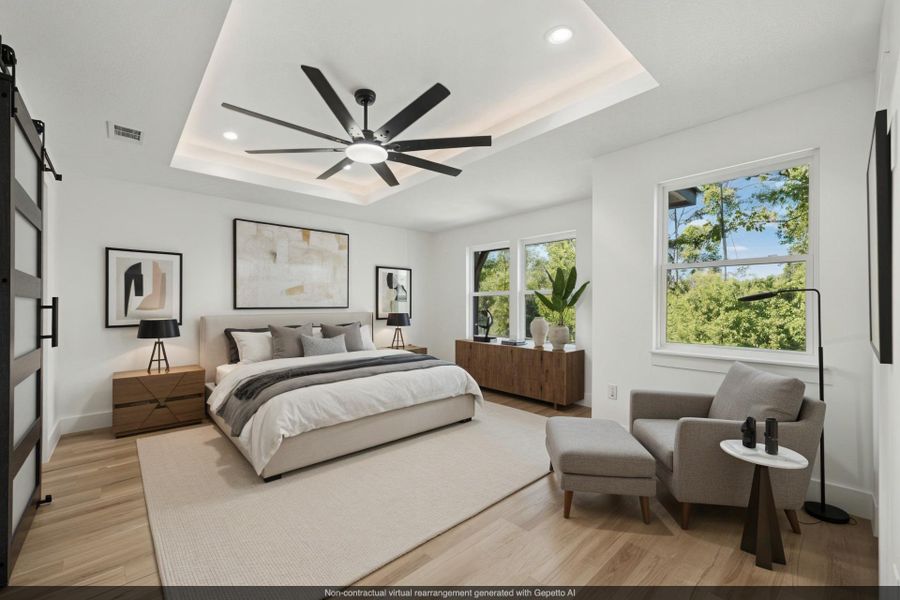 Virtually staged Primary Bedroom featuring a tray ceiling, ceiling fan, light wood-style floors, recessed lighting, and a barn door
