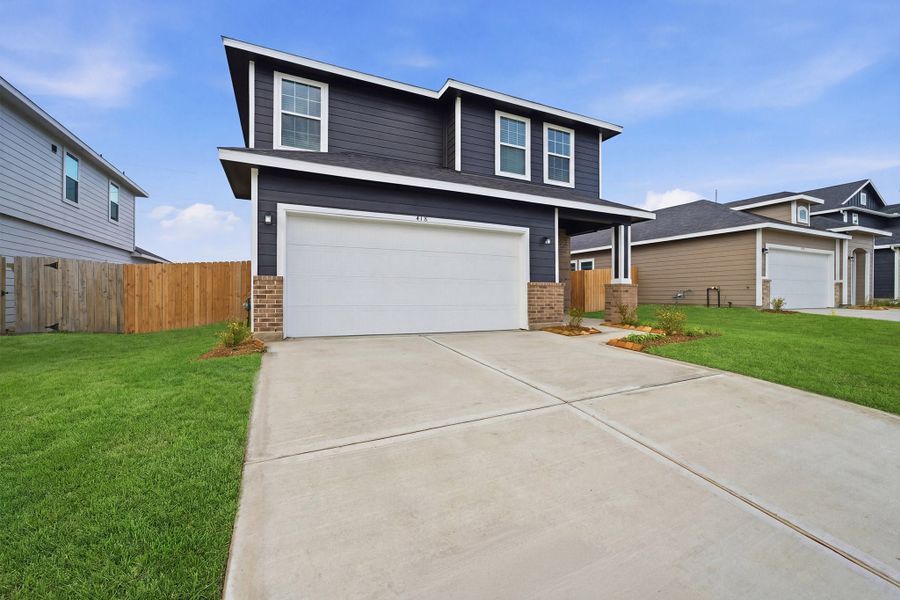 Front exterior of a new home in The Reserve at Huntsville, Huntsville, TX, highlighting curb appeal (Image 2). Front exterior of a new home in The Reserve at Huntsville, Huntsville, TX, highlighting curb appeal (Image 2).