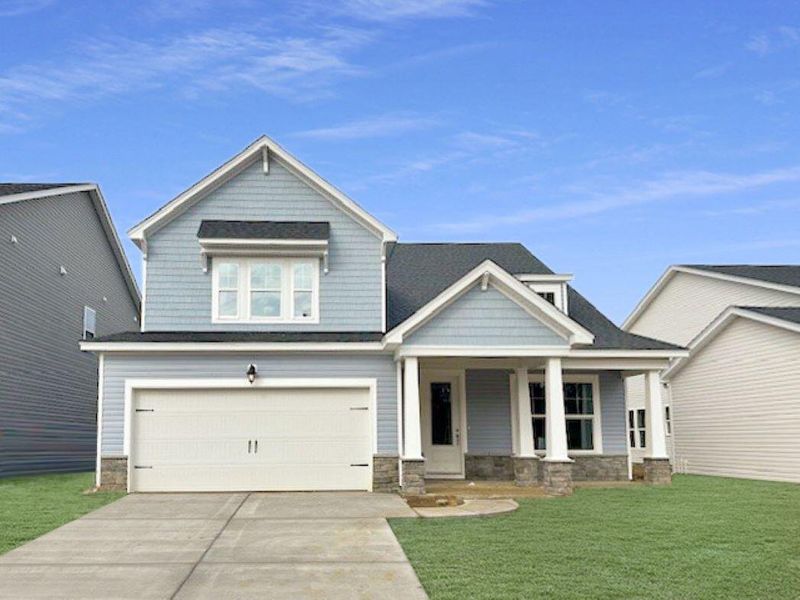 Front exterior of a new home in The Groves of Berkeley, Moncks Corner, SC, highlighting curb appeal (Image 2).
