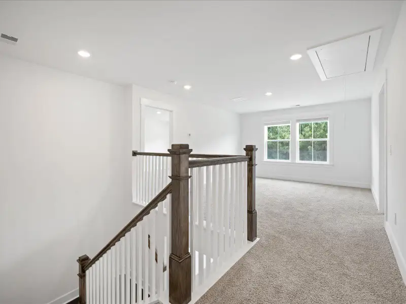 Spacious, unfurnished interior of a new home in The Coves at Lakes of Cane Bay, Summerville (Image 29). Spacious, unfurnished interior of a new home in The Coves at Lakes of Cane Bay, Summerville (Image 29).